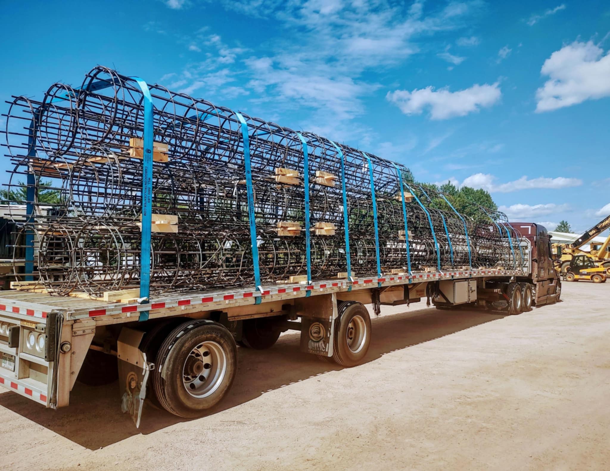 Straps and blocking securing cargo on a flatbed trailer