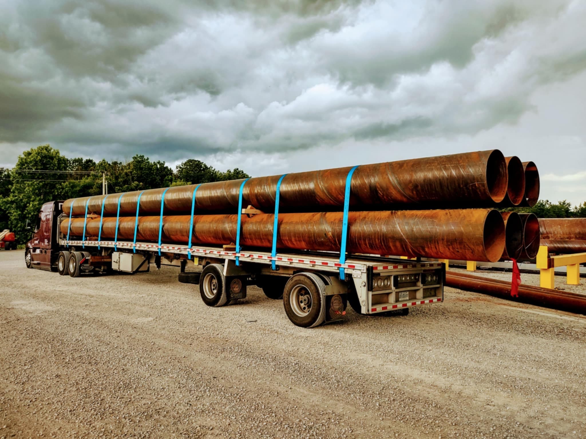 Steel pipes secured on a flatbed trailer